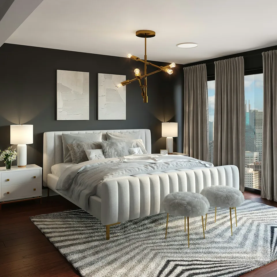 Cama con cabecero claro en un dormitorio contemporáneo.